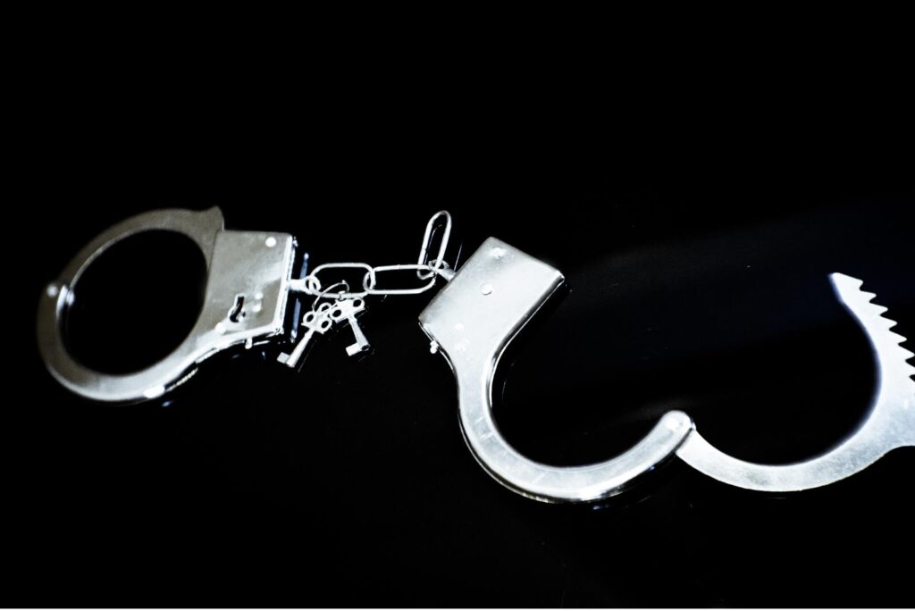 Handcuffs on black background