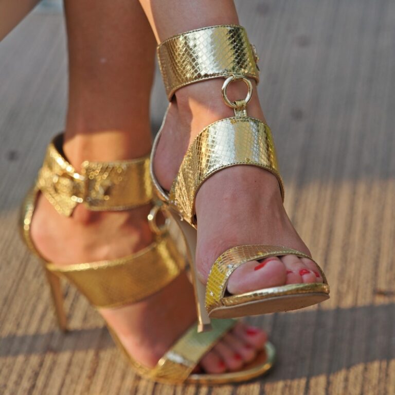 Mistress Lily K foot in golden heels